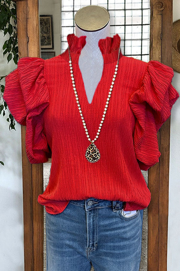 Haut texturé à manches bouffantes et col en V à volants