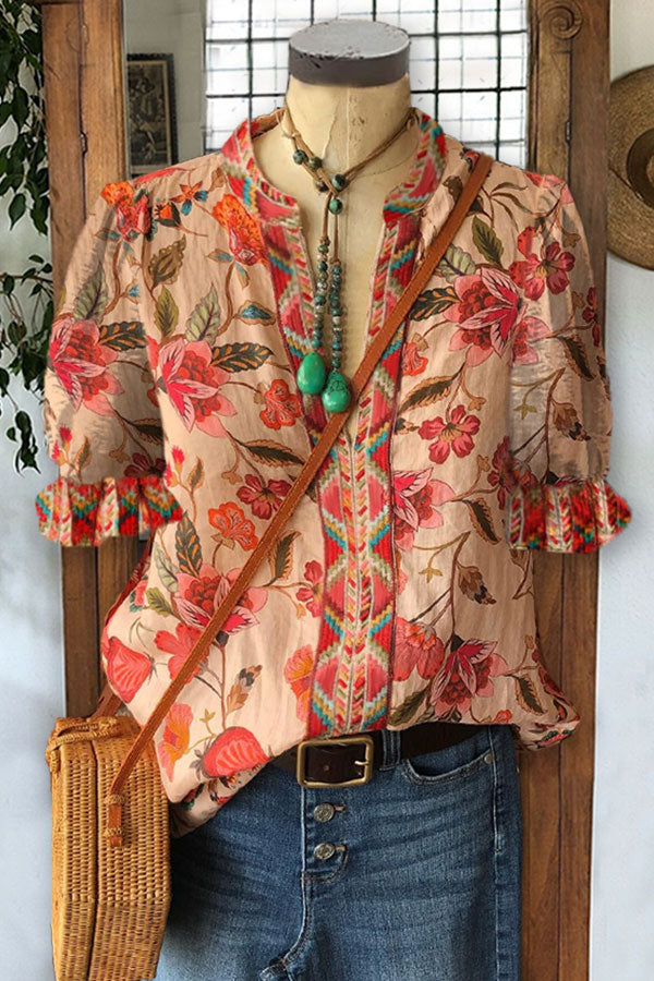 Elegantes Oberteil mit Blumenmuster und geometrischem Muster und Puffärmeln