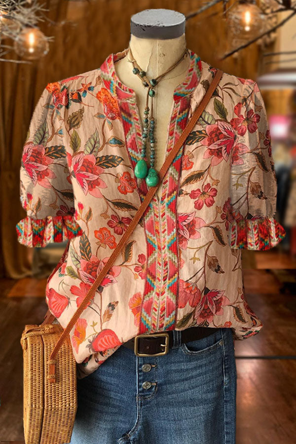 Elegantes Oberteil mit Blumenmuster und geometrischem Muster und Puffärmeln