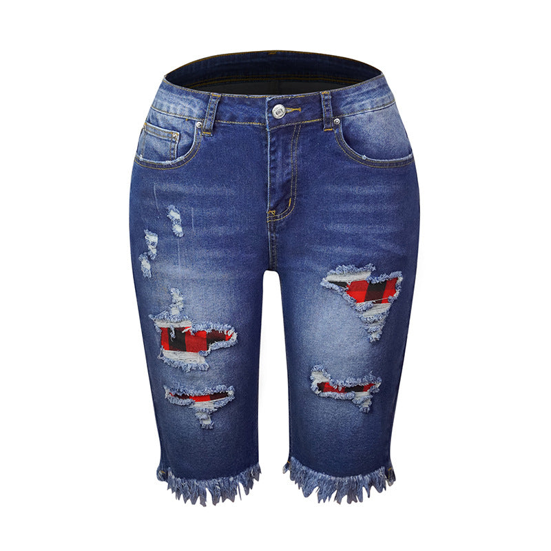 Perforierte Jeansshorts mit hohem Stretchanteil und Quaste