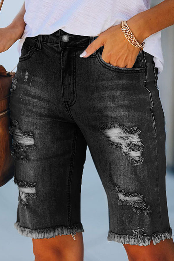Perforierte Jeansshorts mit hohem Stretchanteil und Quaste