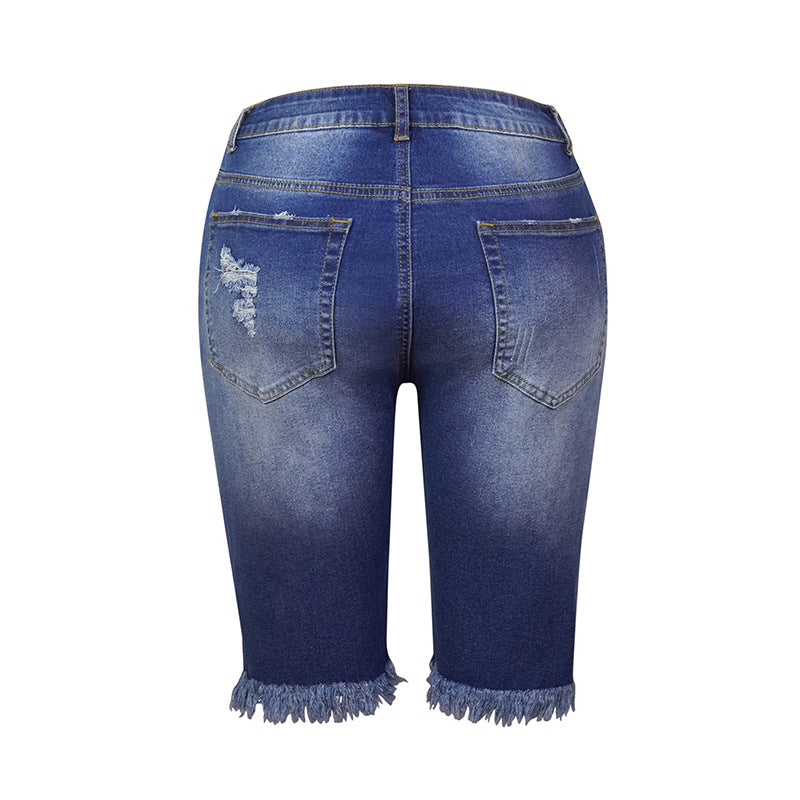 Perforierte Jeansshorts mit hohem Stretchanteil und Quaste