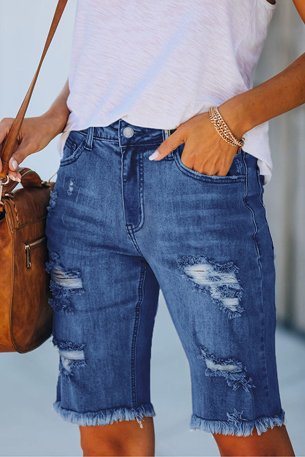 Perforierte Jeansshorts mit hohem Stretchanteil und Quaste